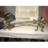 A set of brass ball & claw fire irons & dogs