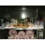 A shelf of assorted glassware including 2 dressing table sets