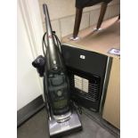 A gas space heater and a hoover vacuum cleaner