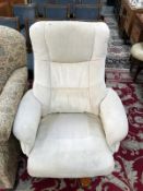 A cream coloured upholstered executive chair