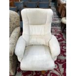 A cream coloured upholstered executive chair