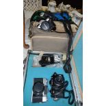 A mixed lot of assorted camera's and cases.