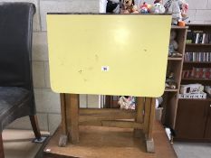 A small drop leaf kitchen table