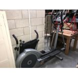 A cross trainer machine and a swing exerciser