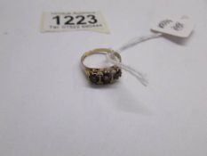 A 9ct gold ring set 3 amethyst's, size N.