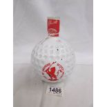 A sealed bottle of St. Andrews golf ball whisky.