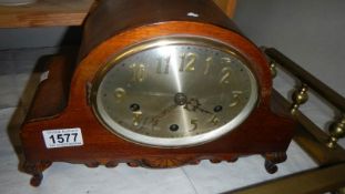 A Westminster chime mantel clock with key.