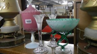 A pair of glass vases, a pink glass lidded pot and a modern glass dish,.