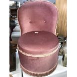 A pink upholstered bedroom chair