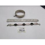 A silver bangle (Kirwan & Co., Ltd.