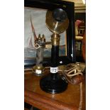 An old candlestick telephone.
