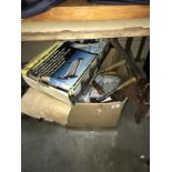 A box of old hand tools and a wallpapering aid