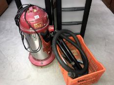 A Readyvac standing cylinder vacuum cleaner