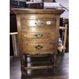 An oak 3 drawer side cabinet