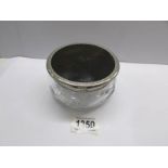 A glass powder pot with silver coloured metal and faux tortoiseshell lid, number and mark on base.