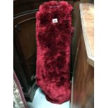 A red deep shag pile rug (1.6m x 1.