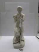 A 19th century parian figure of a seated man, fingers a/f.