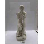 A 19th century parian figure of a seated man, fingers a/f.