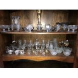 2 shelves of drinking glasses, vases & ornaments etc.