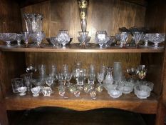 2 shelves of drinking glasses, vases & ornaments etc.
