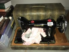 A boxed Federation hand-cranked sewing machine