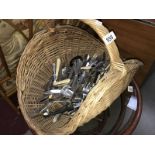 A basket of miscellaneous cutlery