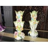 A pair of floral decorated vases.