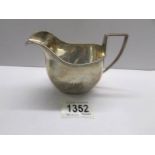 A silver cream jug, Birmingham 1922/23, Approximately 4.25 ounces.
