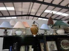 A shelf of modern table lamps