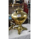 A 19th century brass tea urn.