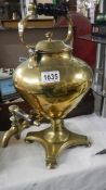 A 19th century brass tea urn.