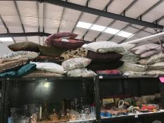 A large quantity of cushions (some singles,