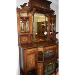 An inlaid mirror backed sideboard.