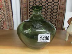 An Erik Hoglund green art glass vase with label.