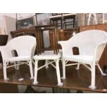 2 white painted wicker armchairs & a wicker coffee table