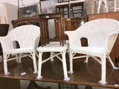 2 white painted wicker armchairs & a wicker coffee table