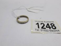 A foreign eternity ring (possibly gold and silver).