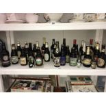 A shelf full of various bottled ales & beers