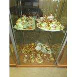 A collection of assorted miniature tea sets with floral patterns including Lime House Studio,