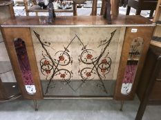 A glazed display case with painted flower decoration