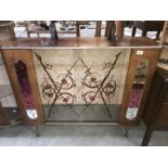 A glazed display case with painted flower decoration