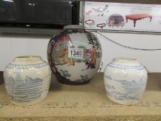 A pair of early Chinese ginger jars and a larger example, all missing lids.