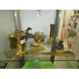 A mixed lot of brass ware including shell case, horse brasses etc.