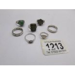 A silver marcasite ring, 4 other silver rings and 2 unmarked rings.