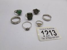 A silver marcasite ring, 4 other silver rings and 2 unmarked rings.