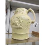 An early salt glaze jug decorated with lions and coats of arms.