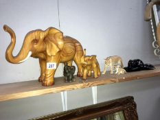 2 wooden elephants,