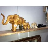 2 wooden elephants,