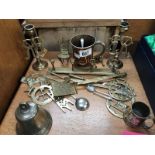 A quantity of brassware including horse brasses and an old brass bell