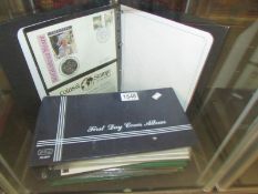 2 albums of first day covers and an album of coin first day covers.